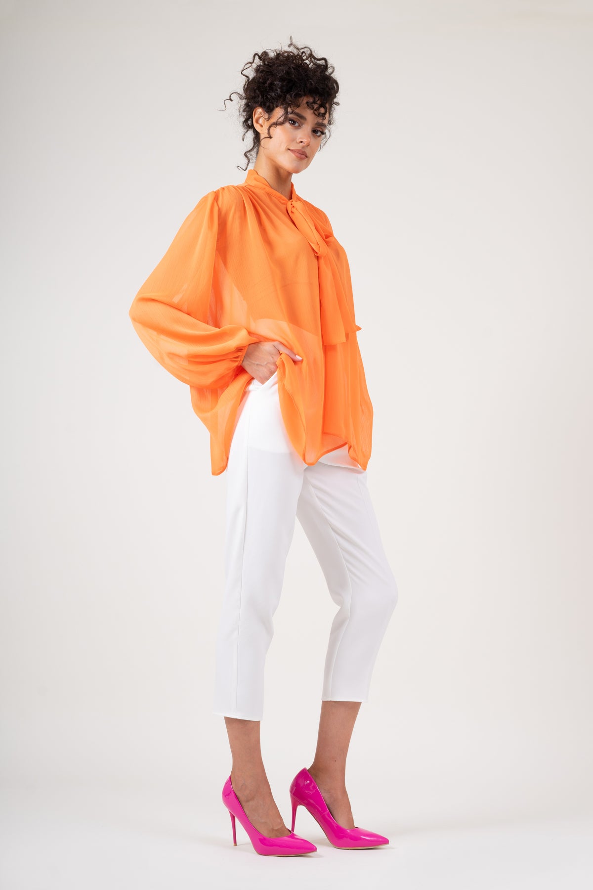 Orange chiffon blouse with draped shoulders & bow ribbon
