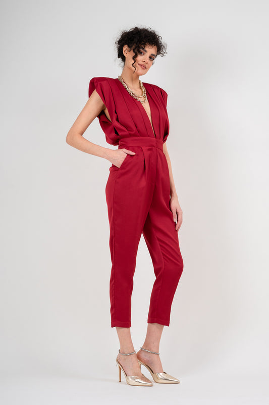 Red draped jumspuit with conical trousers