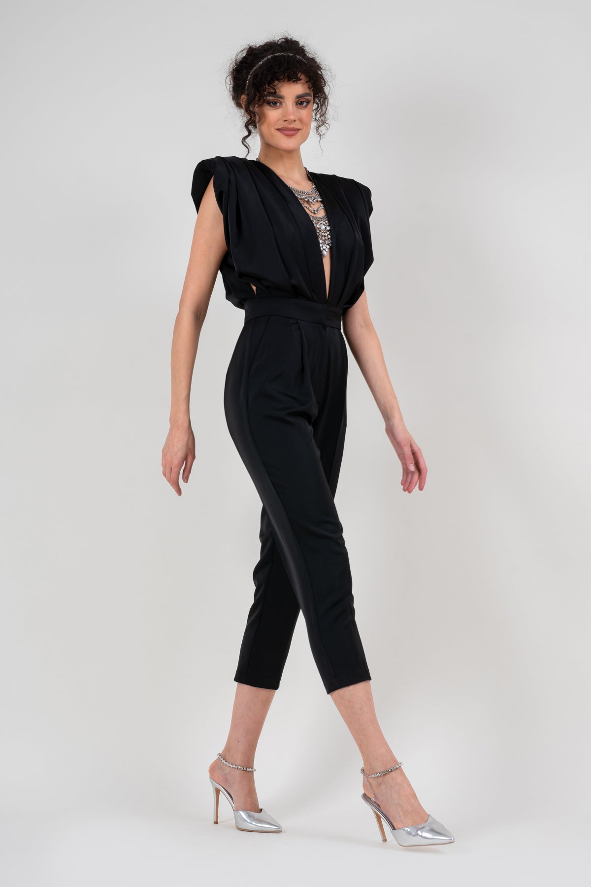 Black draped jumspuit with conical trousers