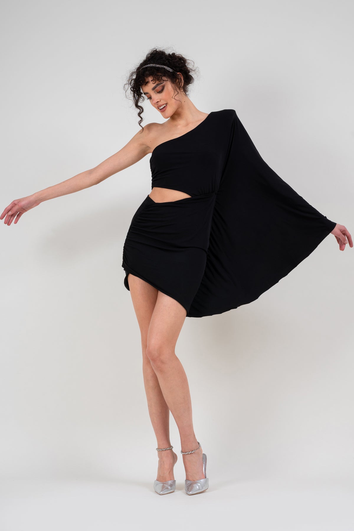 Mini black dress with flared sleeve and waist cutout