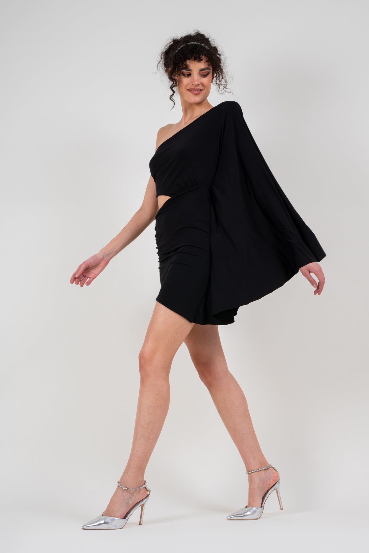 Mini black dress with flared sleeve and waist cutout