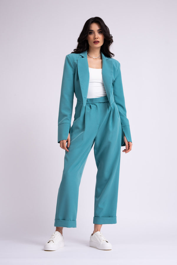 Turquoise suit with cropped blazer and trousers