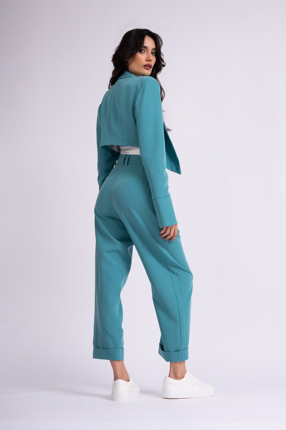 Turquoise suit with cropped blazer and trousers