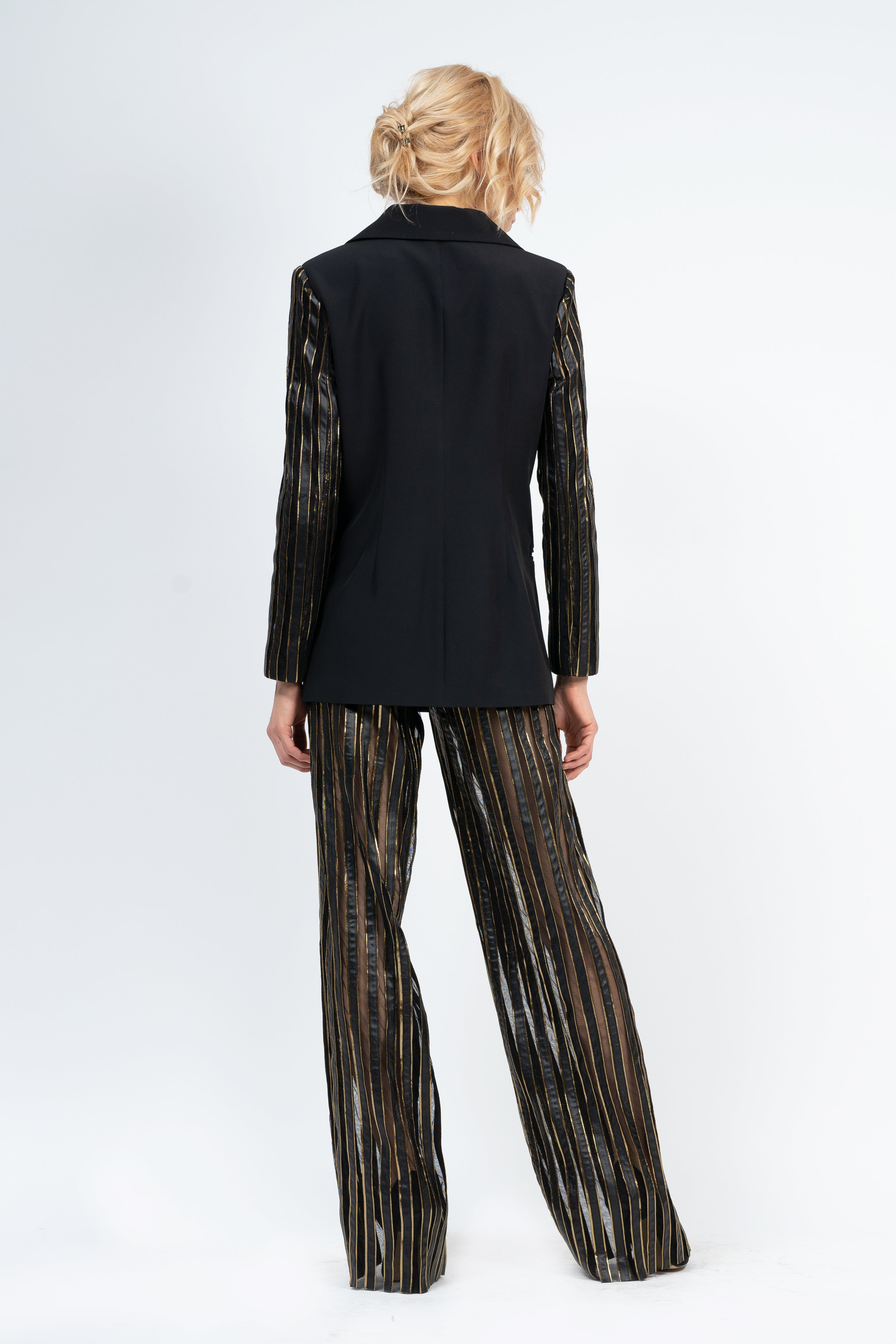 Black suit with gold inserts and tulle