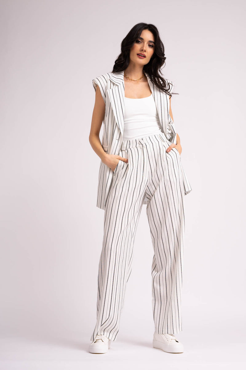 Suit with oversized vest and wide leg trousers made in linen with stripes