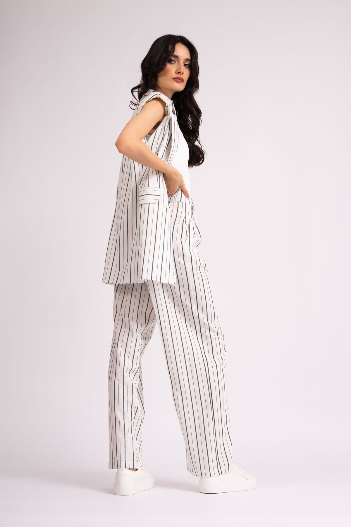 Suit with oversized vest and wide leg trousers made in linen with stripes