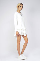 Cambered white dress with ruffles