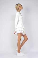 Cambered white dress with ruffles