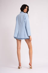 Baby blue suit with oversized blazer with double lapels and shorts with skirt