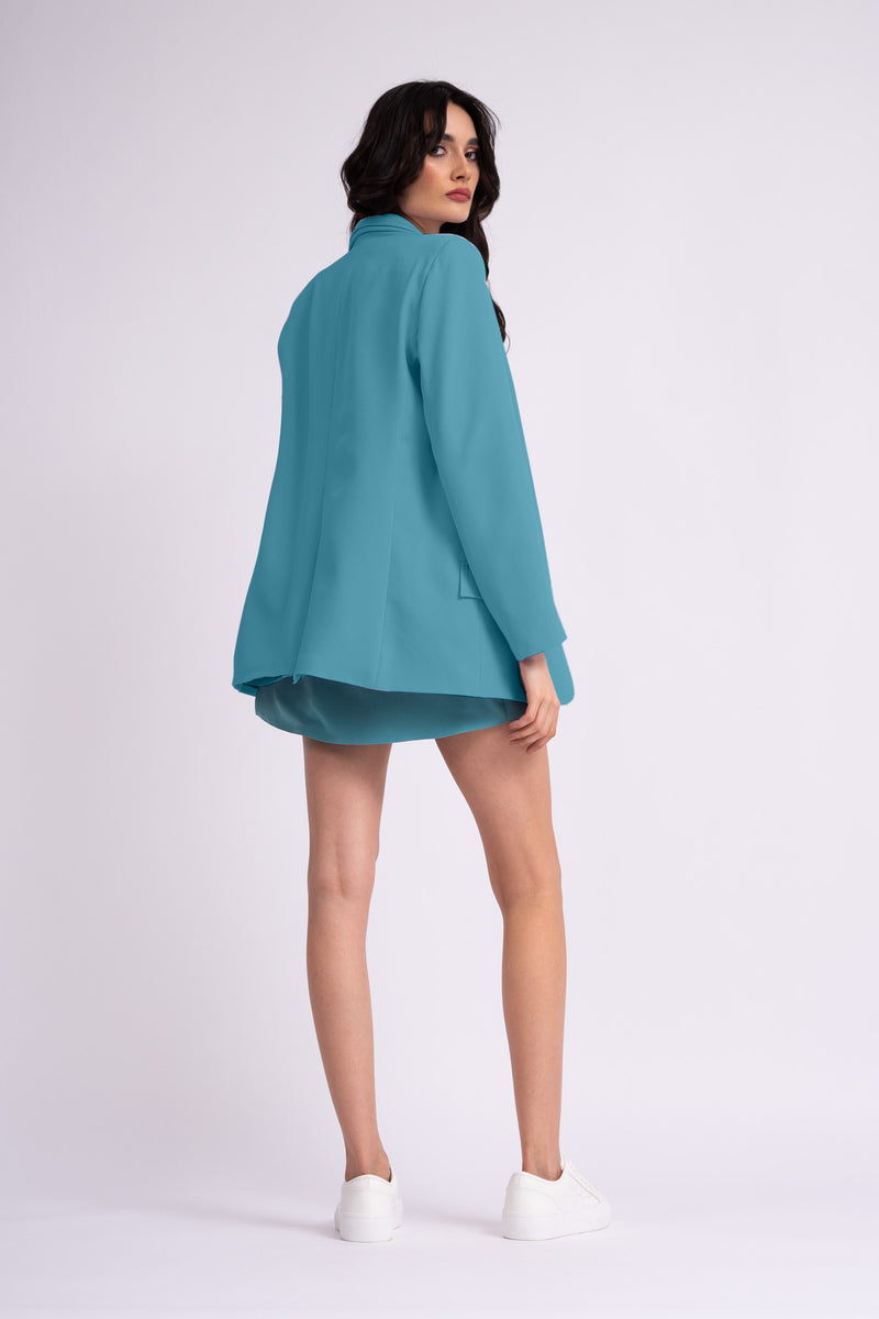 Turquoise suit with oversized blazer with double lapels and shorts with skirt